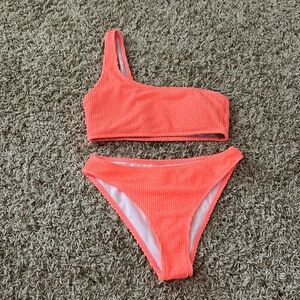 Pink of the shoulder swim suit